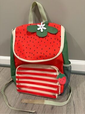 Used Skip Hop Red and Green Strawberry Backpack with Clear Striped Pocket